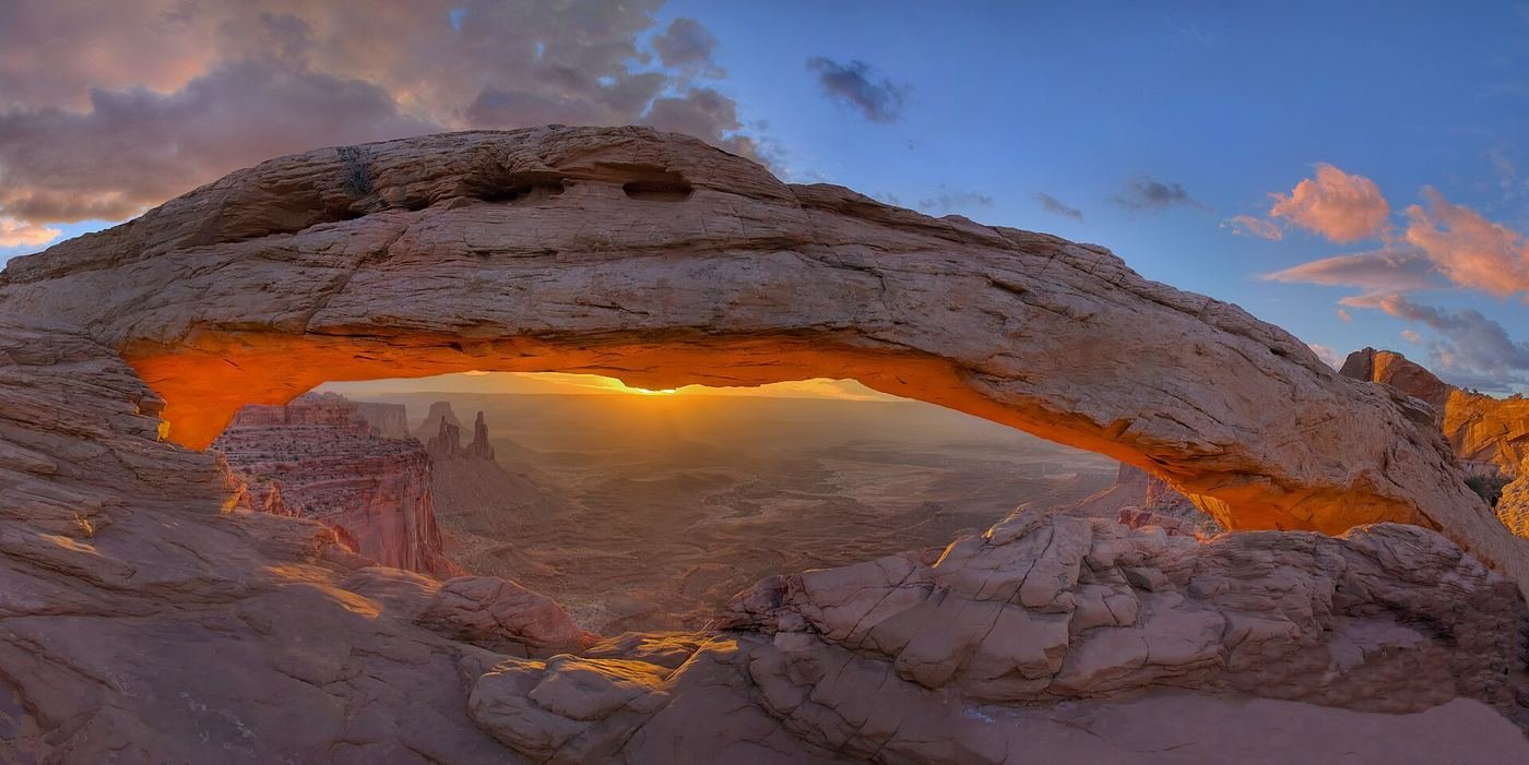 Mesa Arch glowing at sunrise in Canyonlands National Park