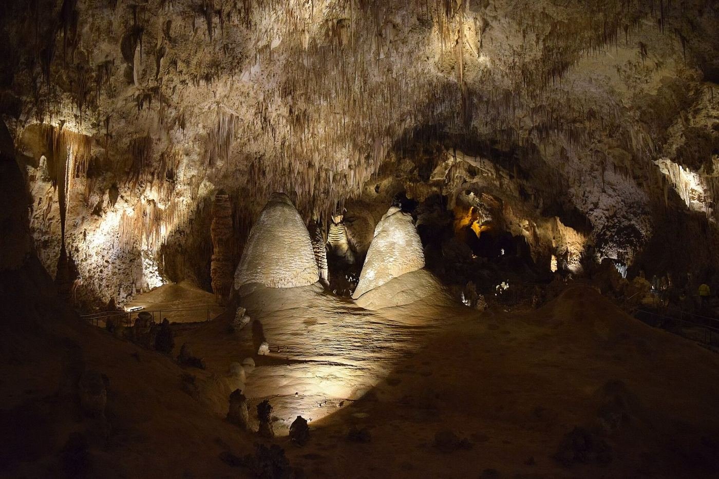 Massive limestone formations lit along the trail in the Big Room of Carlsbad Cavern